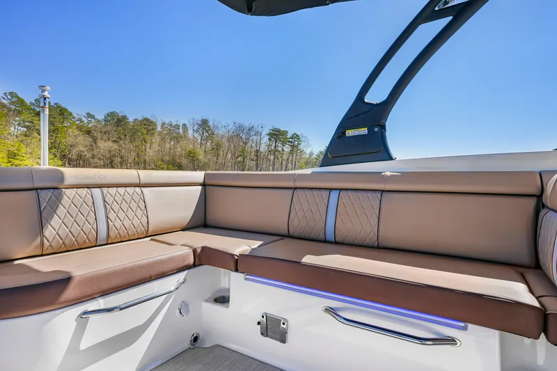 Slide: The Image of 2017 Sea Ray SDX 270 Outboard interior with tan leather seating and modern design. - 9
