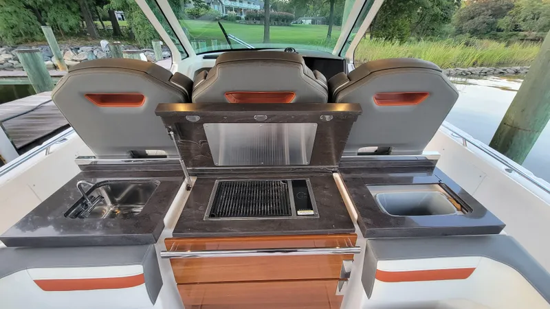 Slide: The Image of 2019 Tiara Sport 38 LS boat interior with modern kitchen amenities. - 10