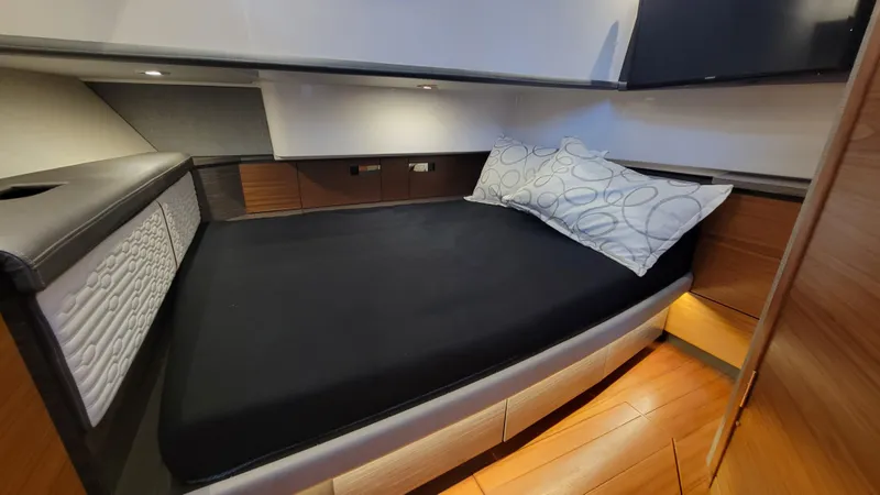 Slide: The Image of Luxurious cabin interior of 2019 Tiara Sport 38 LS with modern bedding. - 12