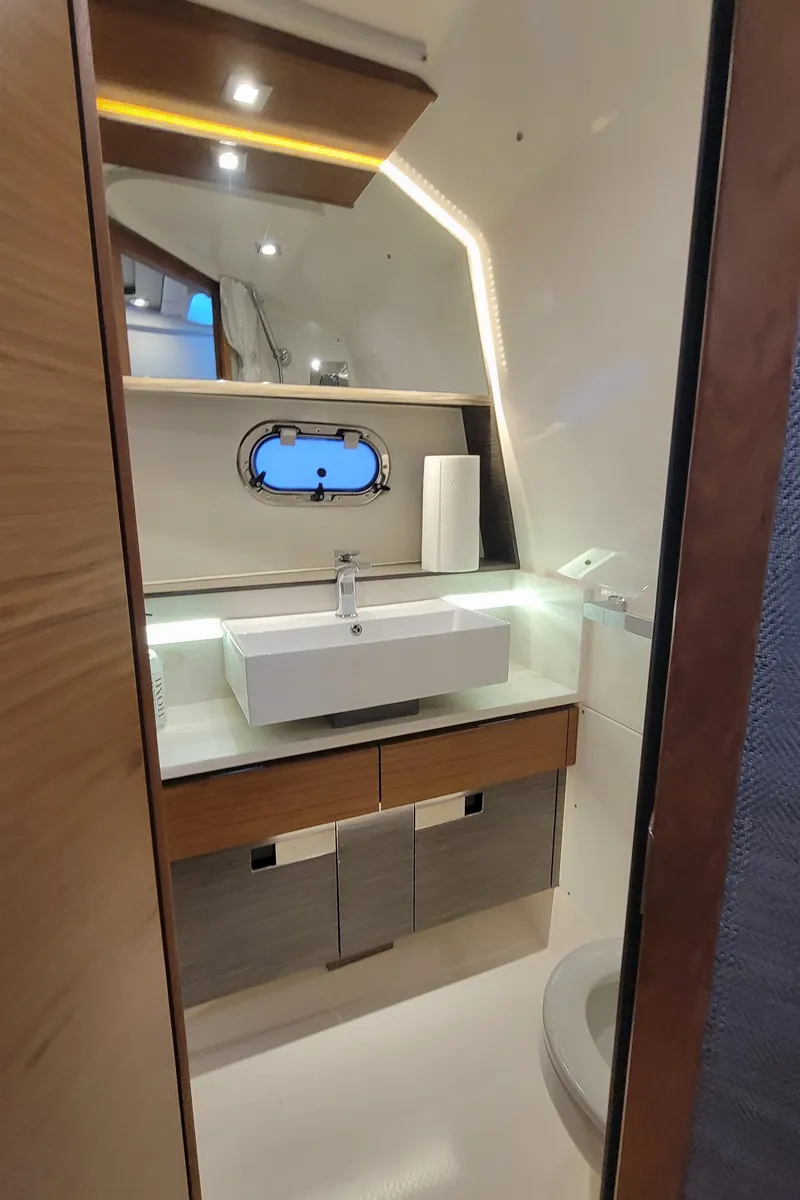 Slide: The Image of Luxurious bathroom interior of 2019 Tiara Sport 38 LS yacht with modern sink and lighting. - 13