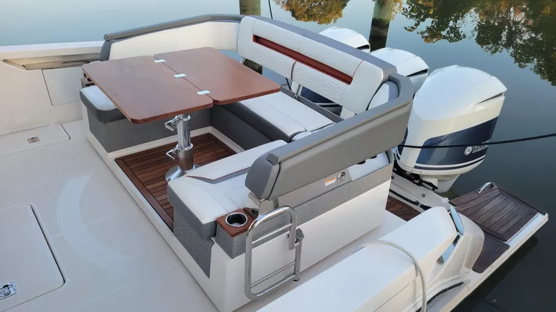 Slide: The Image of 2019 Tiara Sport 38 LS boat with elegant seating and twin outboard engines. - 3