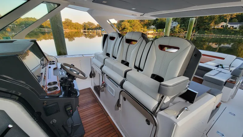 Slide: The Image of 2019 Tiara Sport 38 LS boat interior with modern helm and seating. - 6