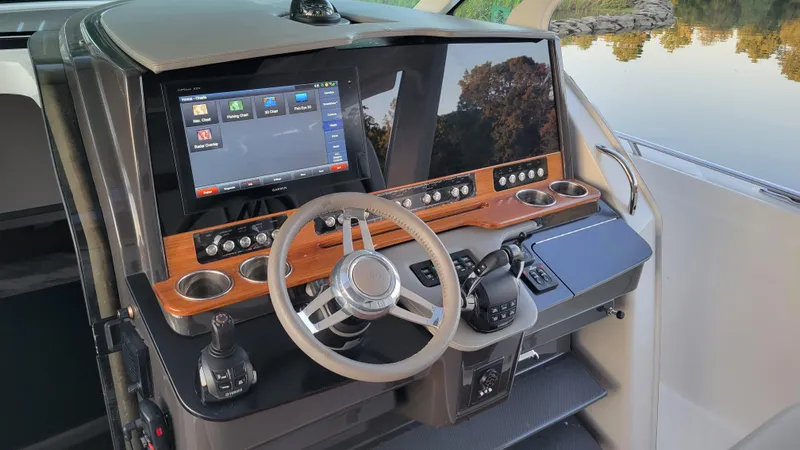 Slide: The Image of 2019 Tiara Sport 38 LS helm with modern controls and touchscreen display. - 8