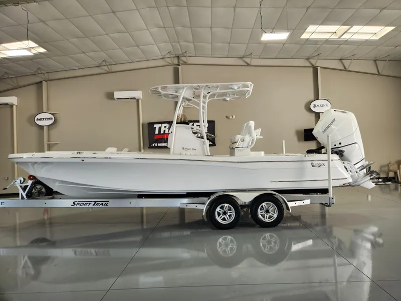 The Image of 2025 BlackJack 256 Coastal boat on trailer in showroom. - 0