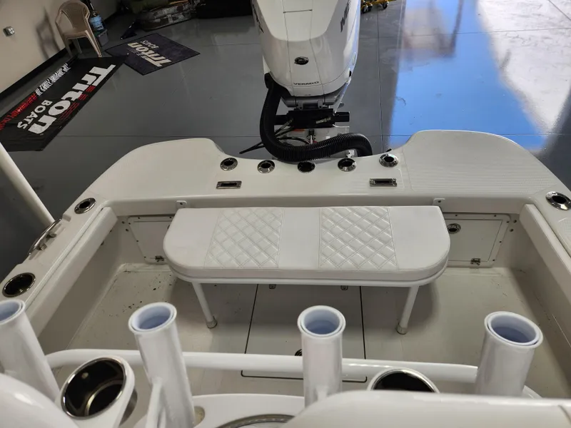 Slide: The Image of 2025 BlackJack 256 Coastal boat interior with seating and rod holders. - 11