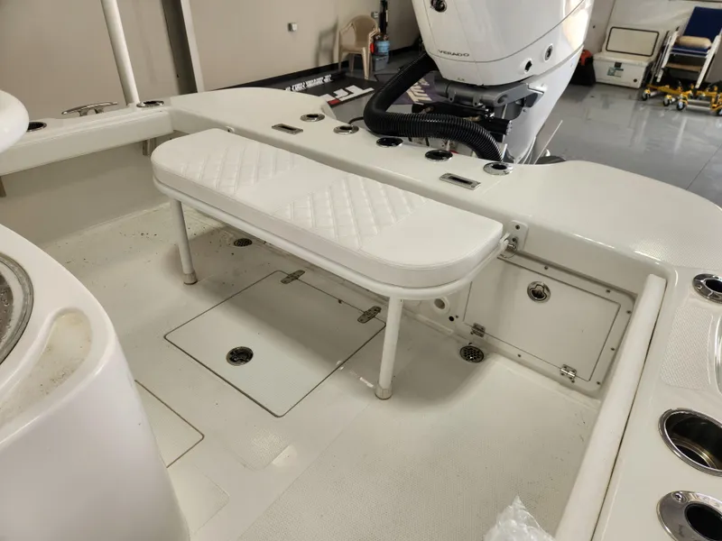 Slide: The Image of 2025 BlackJack 256 Coastal boat interior with white seating and storage compartments. - 12