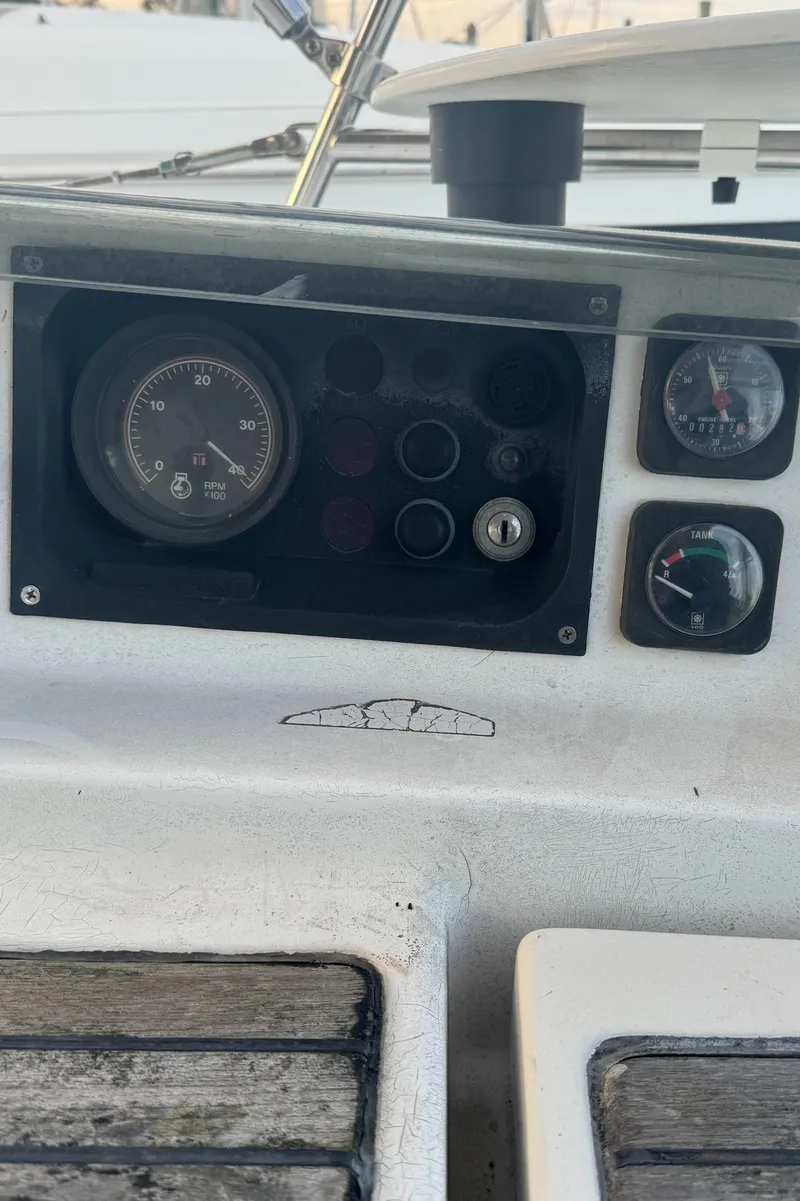 Slide: The Image of Control panel of a 2001 Beneteau 361 sailboat with gauges and switches. - 10