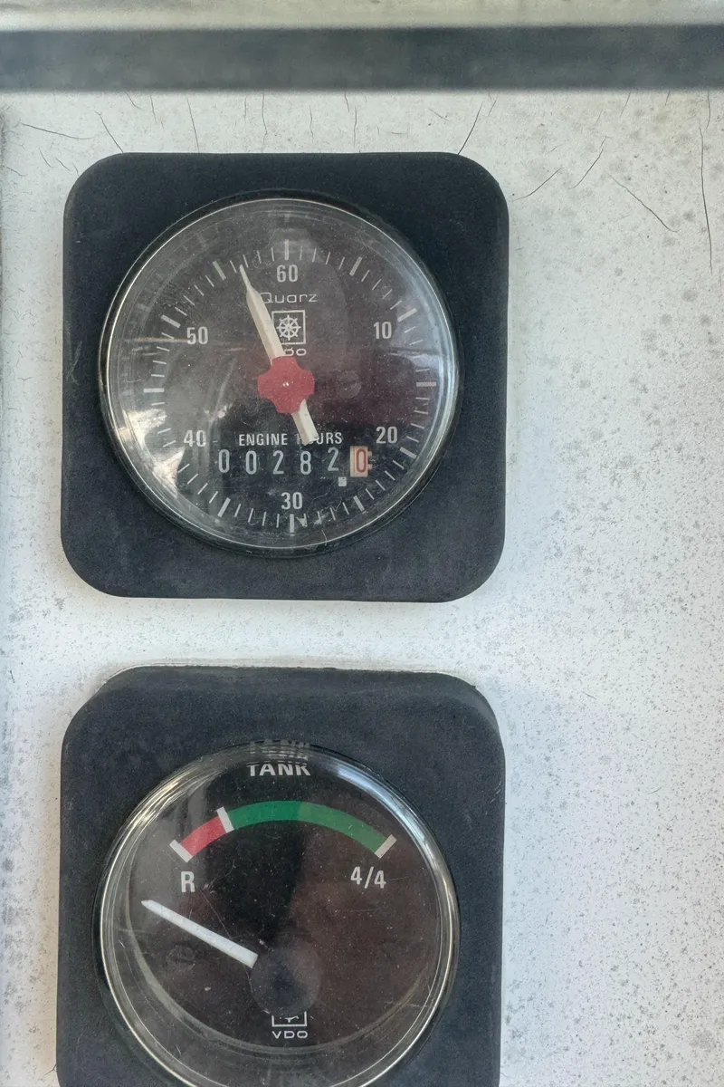 Slide: The Image of Close-up of Beneteau 361 engine hour and fuel gauges, 2001 model. - 11