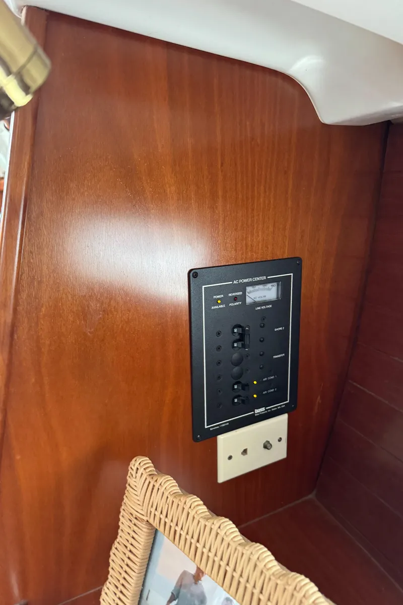 Slide: The Image of Electrical panel on 2001 Beneteau 361 yacht with wooden interior. - 42