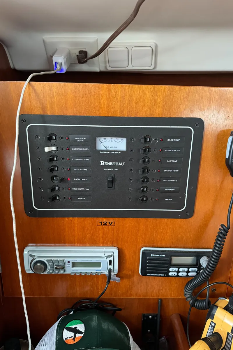 Slide: The Image of Control panel of a 2001 Beneteau 361 sailboat with radio and electrical switches. - 43