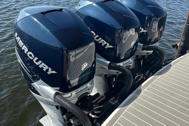 Slide: The Image of Triple Mercury outboard engines on a 2020 Formula 350 Crossover Bowrider OB boat. - 11