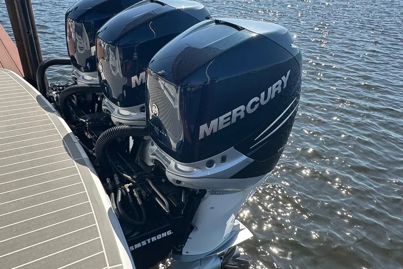 Slide: The Image of Triple Mercury outboard engines on a 2020 Formula 350 Crossover Bowrider OB boat. - 12
