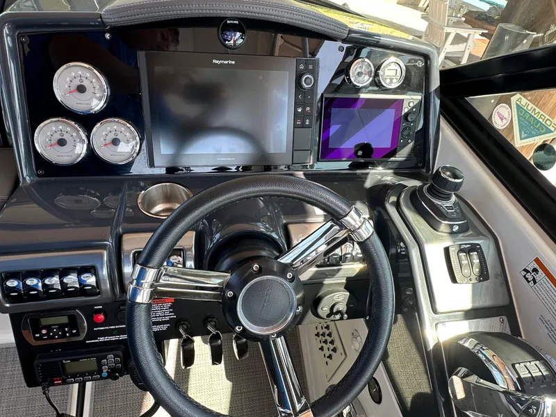 Slide: The Image of 2020 Formula 350 Crossover Bowrider OB dashboard with steering wheel and navigation controls. - 18
