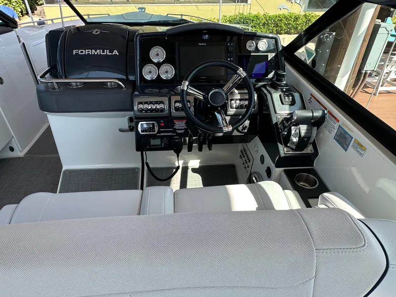 Slide: The Image of 2020 Formula 350 Crossover Bowrider OB cockpit with modern controls and steering wheel. - 19
