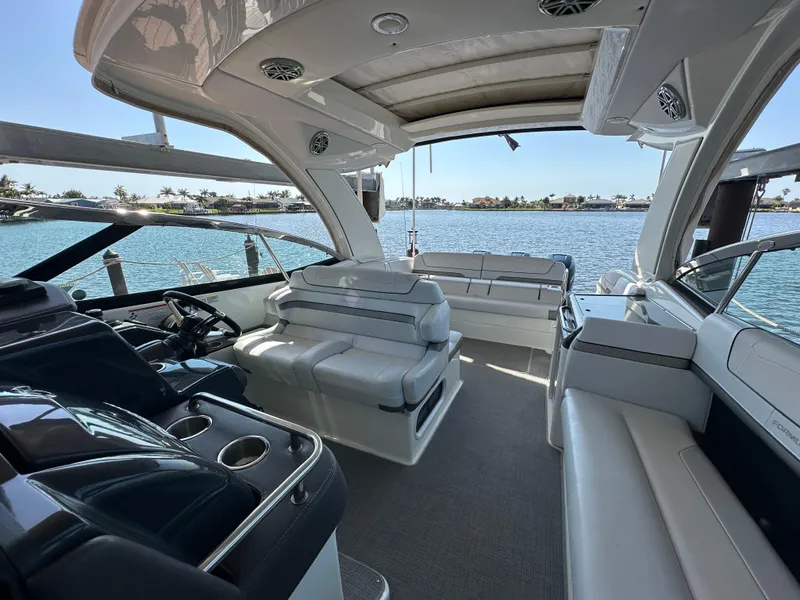 Slide: The Image of 2020 Formula 350 Crossover Bowrider OB interior with luxurious seating and scenic water view. - 21