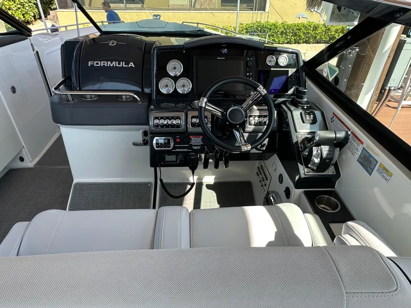 Slide: The Image of 2020 Formula 350 Crossover Bowrider OB cockpit with modern controls and steering wheel. - 22