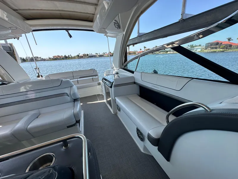 Slide: The Image of 2020 Formula 350 Crossover Bowrider OB interior with luxurious seating and waterfront view. - 23