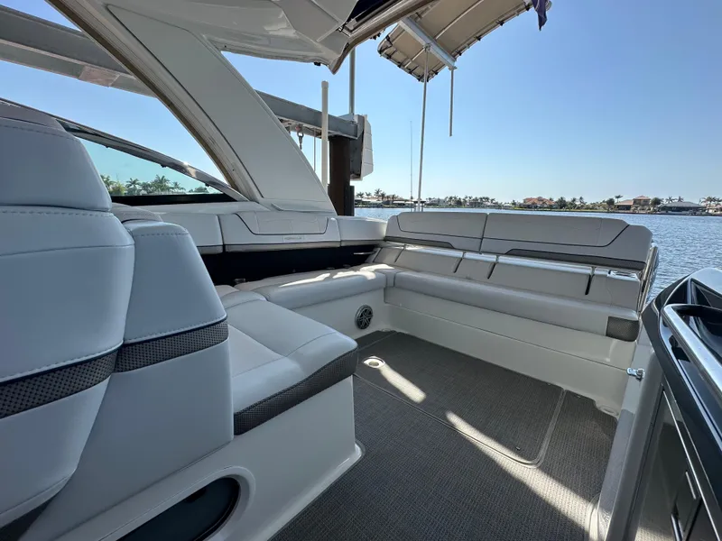 Slide: The Image of 2020 Formula 350 Crossover Bowrider OB interior with spacious seating and scenic water view. - 25