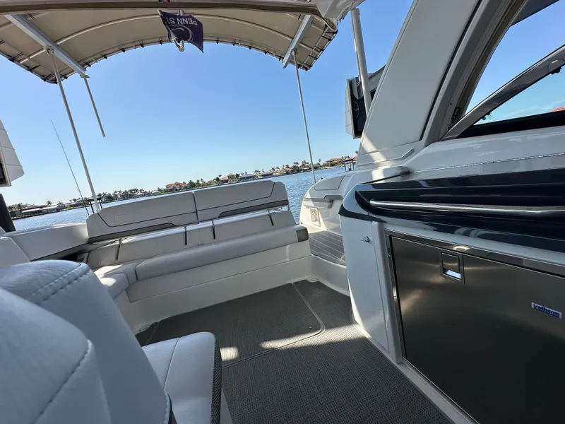 Slide: The Image of 2020 Formula 350 Crossover Bowrider OB interior with seating and water view. - 26