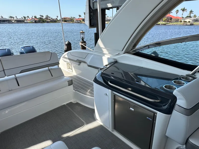 Slide: The Image of 2020 Formula 350 Crossover Bowrider OB interior with seating and water view. - 27
