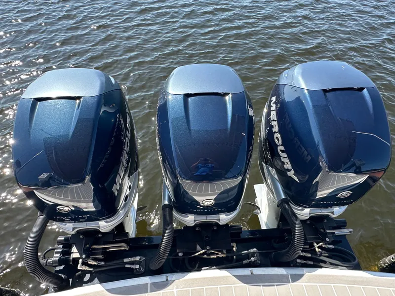 Slide: The Image of Three Mercury outboard engines on a 2020 Formula 350 Crossover Bowrider OB boat. - 7