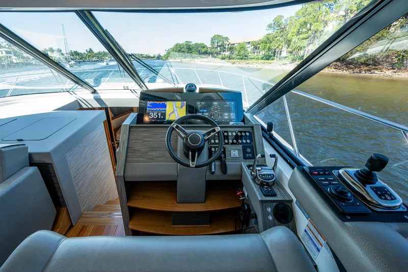 Slide: The Image of 2020 Tiara Yachts C53 Coupe helm with modern navigation and control systems. - 18