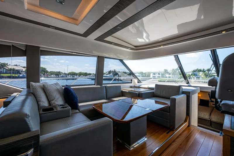 Slide: The Image of Luxurious interior of 2020 Tiara Yachts C53 Coupe with elegant seating and panoramic windows. - 19