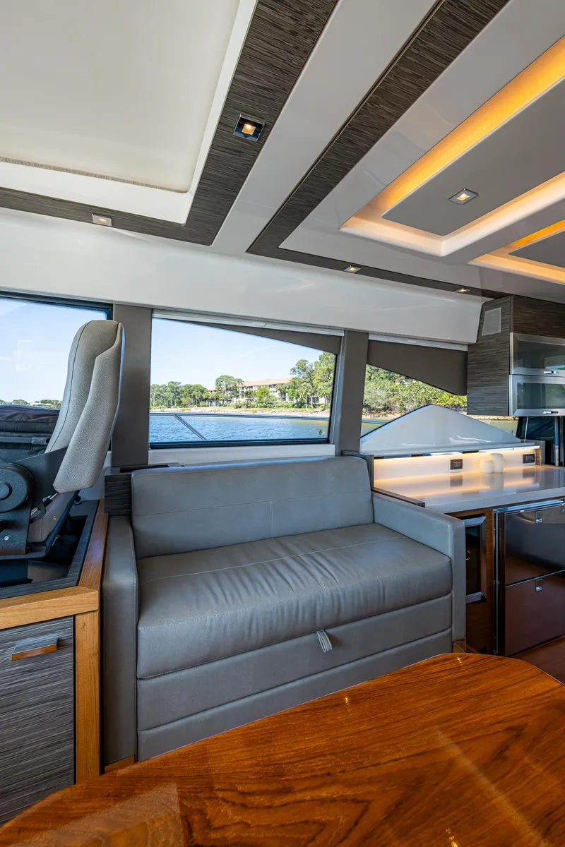 Slide: The Image of Interior of 2020 Tiara Yachts C53 Coupe, featuring modern seating and sleek design elements. - 22