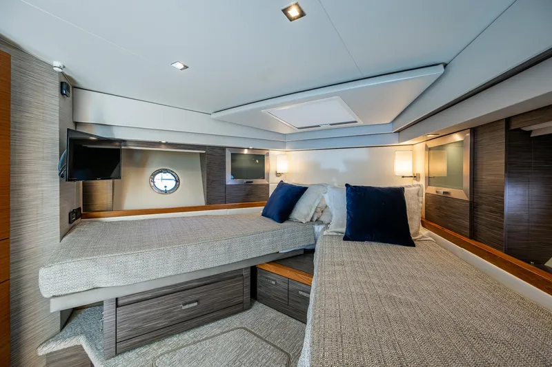 Slide: The Image of Luxurious interior of 2020 Tiara Yachts C53 Coupe with twin beds and modern decor. - 26