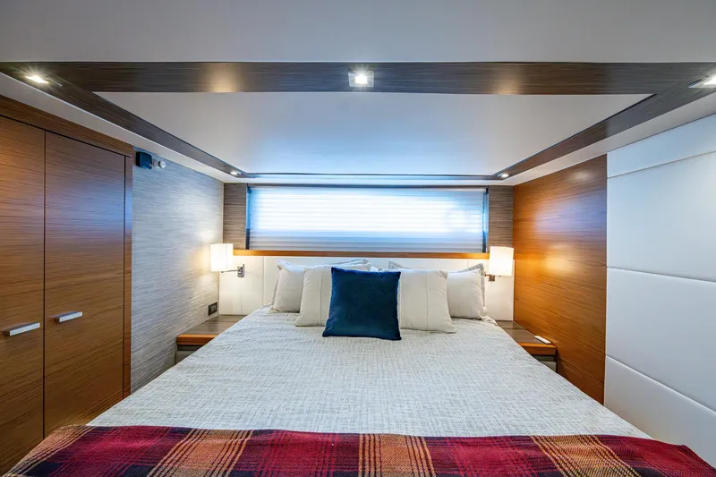 Slide: The Image of Luxurious bedroom interior of 2020 Tiara Yachts C53 Coupe with modern design and cozy bedding. - 32