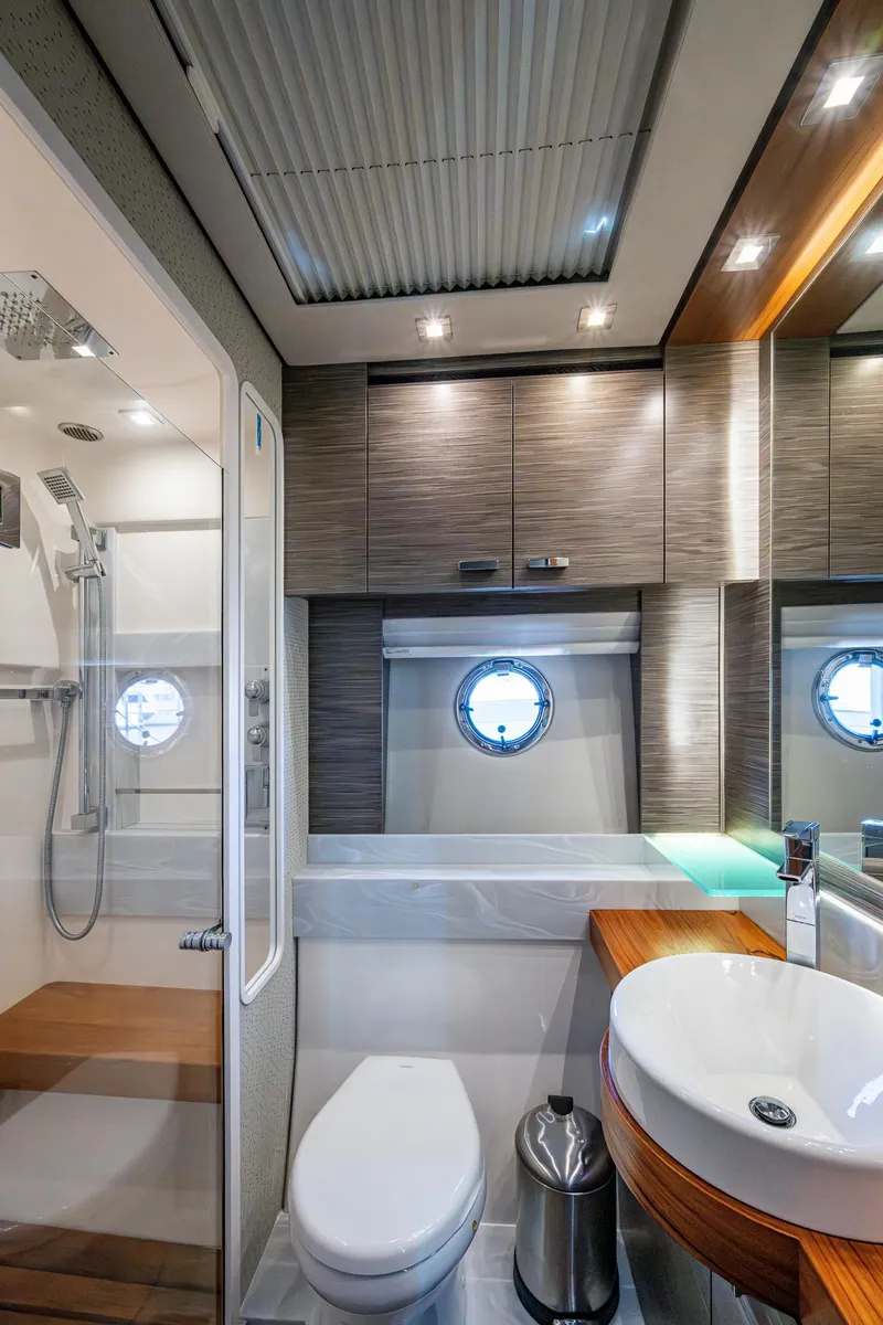 Slide: The Image of Luxurious bathroom in 2020 Tiara Yachts C53 Coupe with modern fixtures and elegant design. - 35