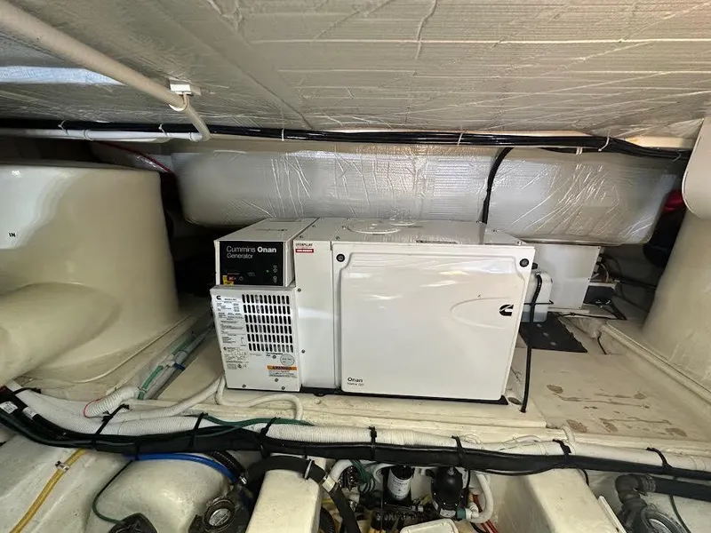 Slide: The Image of Engine room of 2020 Tiara Yachts C53 Coupe with Cummins Onan generator. - 39