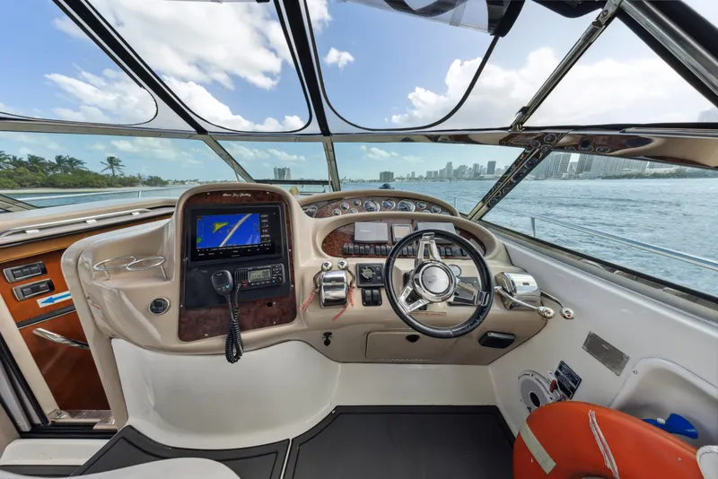 Slide: The Image of Cockpit of 2003 Sea Ray 380 Sundancer yacht with navigation system and steering wheel. - 10