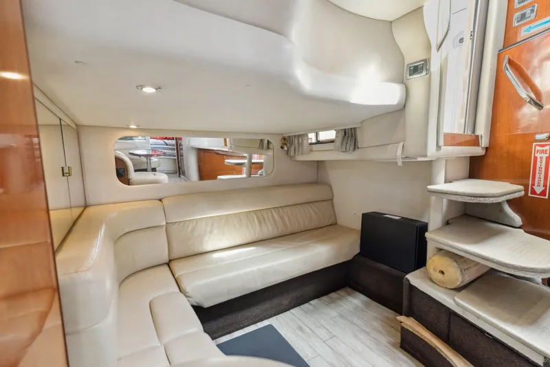 Slide: The Image of Interior of 2003 Sea Ray 380 Sundancer yacht with beige seating and modern design. - 15
