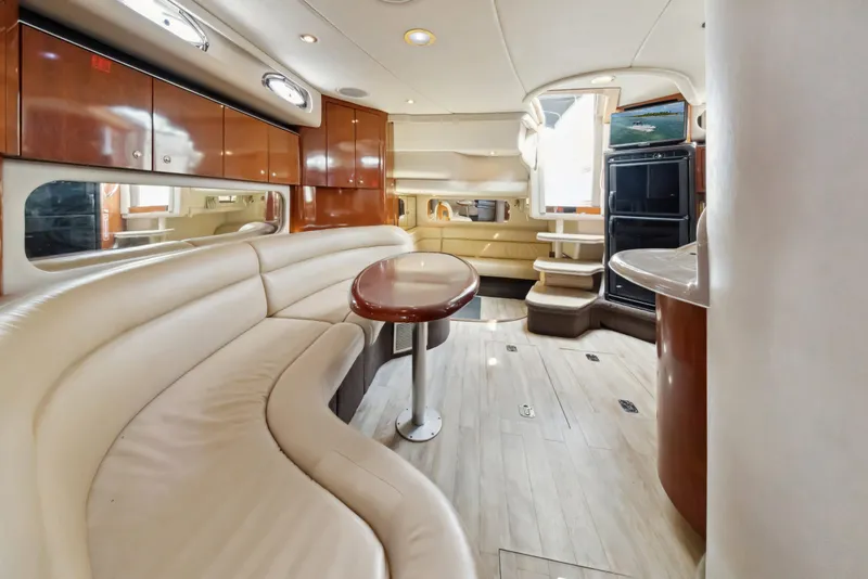 Slide: The Image of Luxurious interior of 2003 Sea Ray 380 Sundancer yacht with elegant seating and cabinetry. - 19