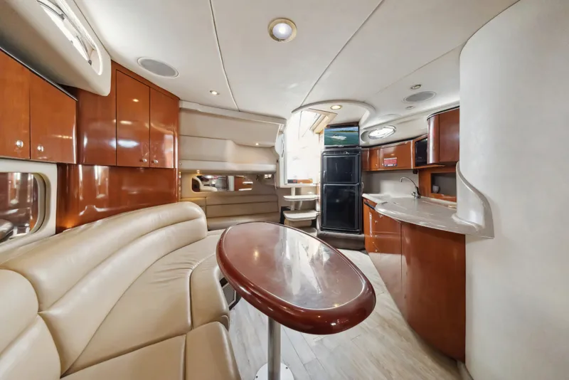 Slide: The Image of Interior of 2003 Sea Ray 380 Sundancer yacht with elegant wood and leather finishes. - 20