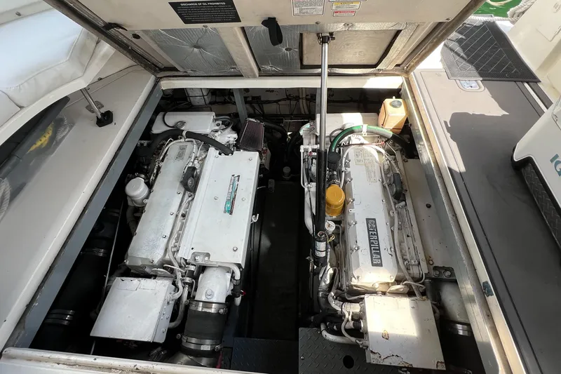 Slide: The Image of Engine compartment of a 2003 Sea Ray 380 Sundancer boat, showcasing dual engines. - 28