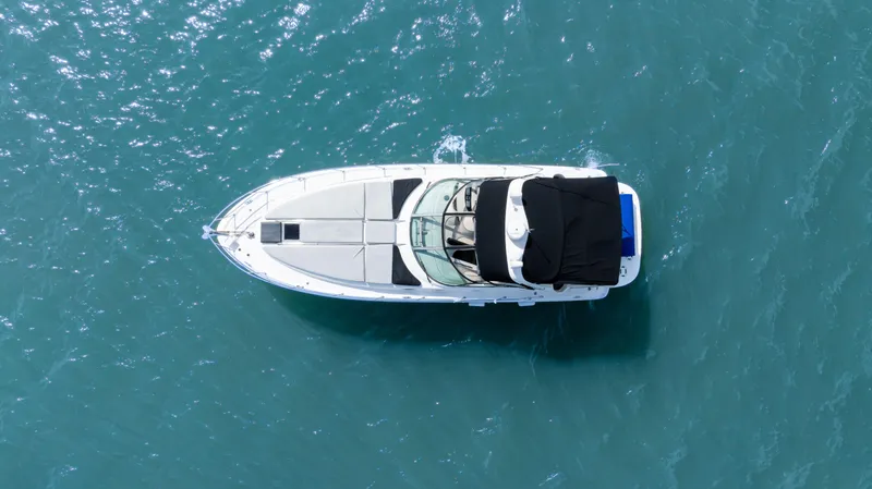 Slide: The Image of Top view of a 2003 Sea Ray 380 Sundancer yacht on blue water. - 3