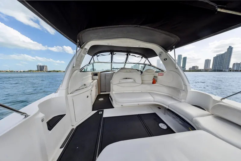Slide: The Image of 2003 Sea Ray 380 Sundancer yacht interior with city skyline in background. - 5