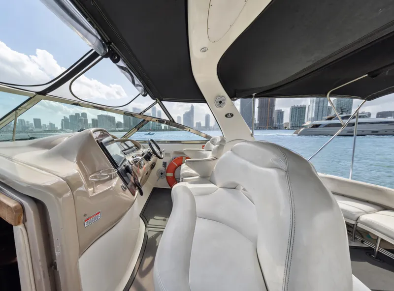 Slide: The Image of Interior view of 2003 Sea Ray 380 Sundancer yacht with city skyline backdrop. - 8