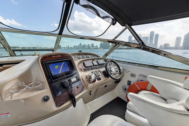 Slide: The Image of Helm of 2003 Sea Ray 380 Sundancer with city skyline view. - 9