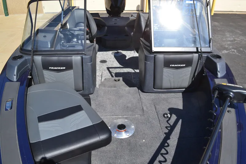 Slide: The Image of 2025 Tracker Targa V-18 Combo boat interior with seating and windshield. - 3