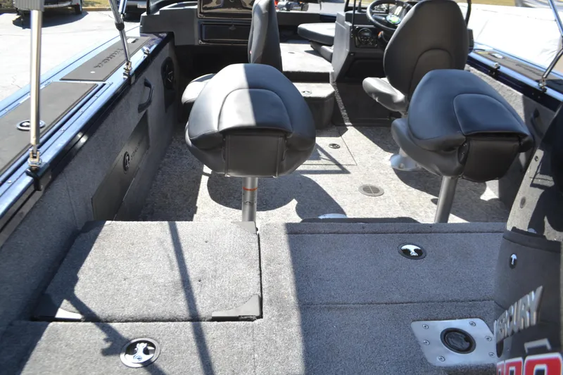 Slide: The Image of 2025 Tracker Targa V-18 Combo boat interior with seating and carpeted flooring. - 4