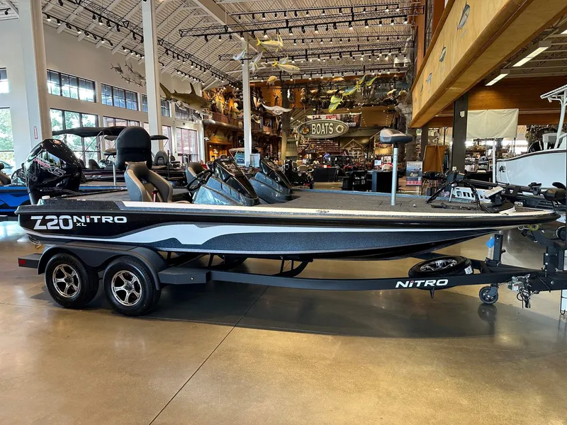 Slide: The Image of 2025 Nitro Z20 XL Pro boat displayed in a showroom, side view. - 0