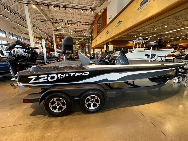 Slide: The Image of 2025 Nitro Z20 XL Pro boat displayed in a showroom, side view. - 1