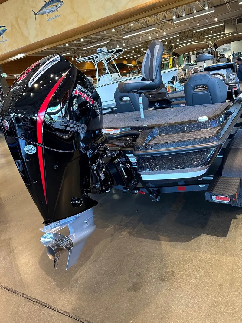 Slide: The Image of 2025 Nitro Z20 XL Pro boat with powerful outboard motor in showroom. - 2