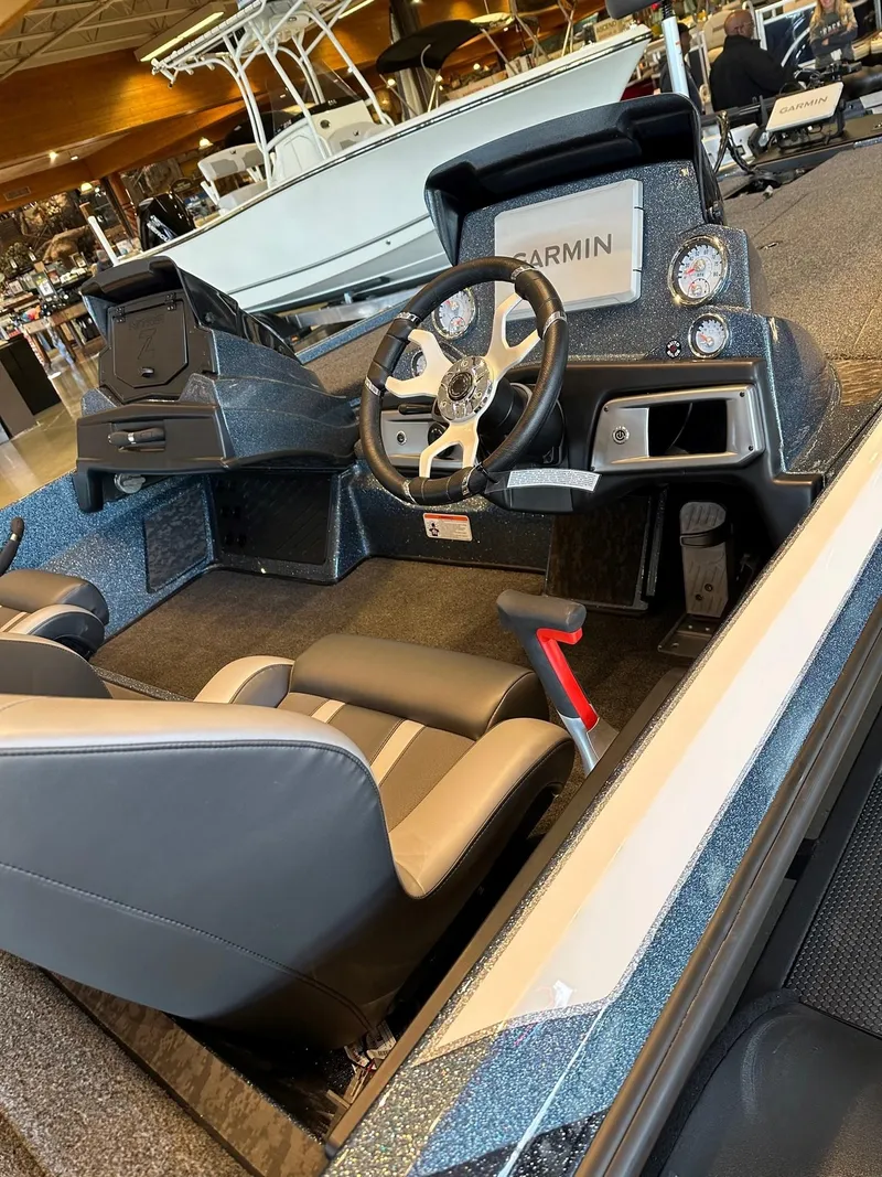 Slide: The Image of 2025 Nitro Z20 XL Pro boat interior with steering wheel and Garmin display. - 3
