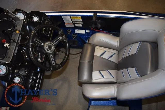 Slide: The Image of 2019 Nitro Z19 boat cockpit with steering wheel and cushioned seat. - 18