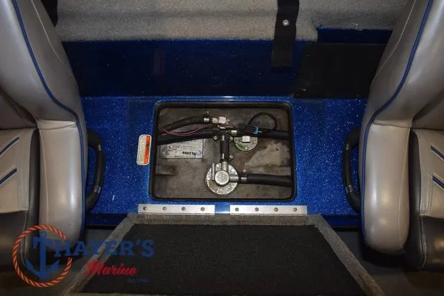 Slide: The Image of 2019 Nitro Z19 boat interior showing fuel tank compartment between seats. - 24