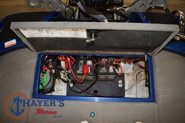Slide: The Image of Open battery compartment of 2019 Nitro Z19 boat with wiring and components. - 26